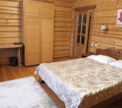 Двуместный номер в деревянном коттедже с cауной в Колыба