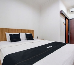 Двухместный номер Deluxe двуспальная кровать в Capital O 93266 Palmier Hotel