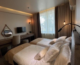 Номер стандарт с 2 односпальными кроватями в Adenium hotel