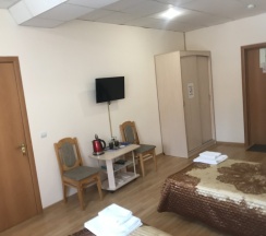 Кровать в общем номере с двумя кроватями в Парнас