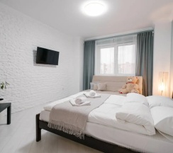 Четырёхместные апартаменты c 1 комнатой с балконом в Апартаменты Light apartment lxt.by