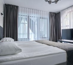 Номер улучшенный комфорт с 1 двуспальной кроватью в Белла