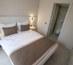 Люкс Deluxe с балконом в Bomo Suites