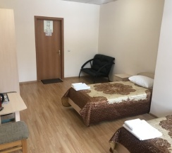 Кровать в общем номере с двумя кроватями в Парнас