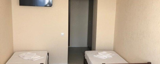 Кровать в 4-местном общем номере в Гостиница
