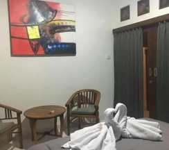 Двухместный номер Standard с балконом и с видом на сад двуспальная кровать в Mai Guesthouse Sanur