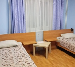 Кровать в общем номере в Зима