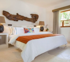 Номер Oasis в Shangri-la Caribe Beach Village Resort