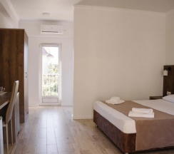 Трёхместный номер Deluxe с балконом в Талион