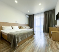 Корпус Андорра Стандарт с Раскладным Двуспальным Диваном в Family Pride Inn Прайд