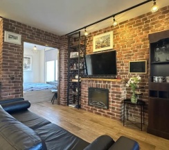 Апартаменты c 1 комнатой с балконом и с видом на город в Квартира в центре Loft