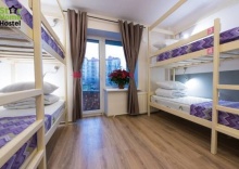 Спальное место в комнате для женщин в Star home