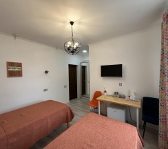 Номер стандарт с 2 односпальными кроватями в Домино