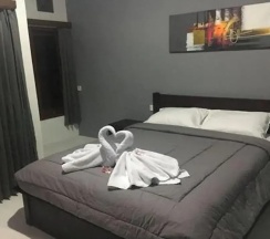 Двухместный номер Standard с балконом и с видом на сад двуспальная кровать в Mai Guesthouse Sanur