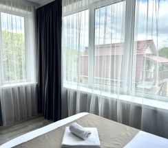 Трехместная комната комфорт в Корнилофф от Травел Хотелс Антураж