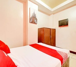 Четырёхместный семейный номер Standard 2 отдельные кровати в OYO 894 Cosmo Hotel P Campa Manila