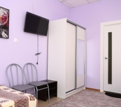 Кровать в 3-местном общем номере в Уютный дом