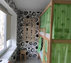 Кровать в общем номере (общая ванная комната) в В библиотеке