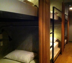Кровать в общем номере в In A Box Hostel