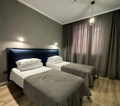 Номер стандарт с 2 односпальными кроватями в Альпина