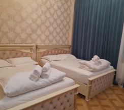 Стандартный четырехместный номер с 2 двуспальными кроватями в За рулем Юг