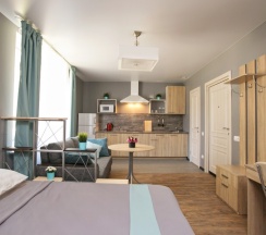 Студия Powder и Aquamarine с одним окном в New Horizon Ovechkin Apartments