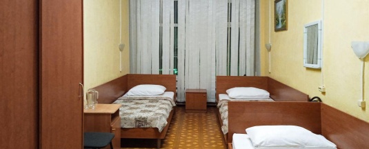 Кровать в 3-местном общем номере в Smart Hotel KDO Бузулук