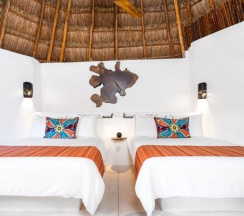 Четырёхместный номер Palapa с видом на сад в Shangri-la Caribe Beach Village Resort