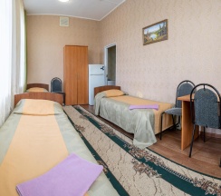 Кровать в 3-местном общем номере в Товарково