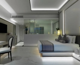 Двухместный номер Deluxe с балконом и с видом на бассейн двуспальная кровать в Chanalai Romantica Resort Kata Beach - Adults Only