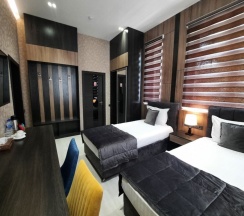 Двухместный номер Deluxe двуспальная кровать в Home Hotel