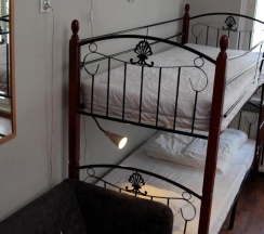 Кровать в общем номере в Pit Stop Hostel