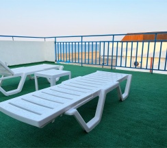 Двухуровневый ПОЛУЛЮКС с зоной отдыха на крыше и видом на море в Santorini Family Club