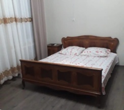 Четырёхместные апартаменты Deluxe с балконом и с красивым видом из окна в Гостевой дом Белый Лотос