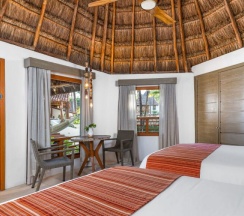 Четырёхместный номер Palapa с видом на сад в Shangri-la Caribe Beach Village Resort