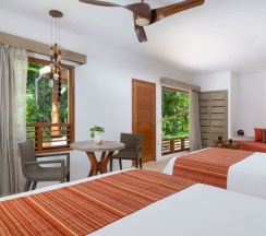 Номер Oasis в Shangri-la Caribe Beach Village Resort