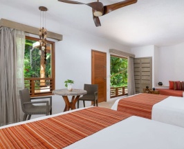 Четырёхместный номер Oasis в Shangri-la Caribe Beach Village Resort