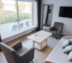 Двухместный коттедж с 3 комнатами с красивым видом из окна двуспальная кровать в Банный остров