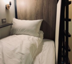 Кровать в общем номере в DAN Hostel