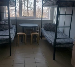 Кровать в 4-местном общем мужском номере (удобства на этаже) в Временный дом