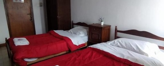Кровать в общем номере в Hostal Tilian