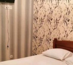 Четырёхместные апартаменты Deluxe с балконом и с красивым видом из окна в Гостевой дом Белый Лотос