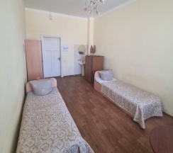 Кровать в общем номере в Волга