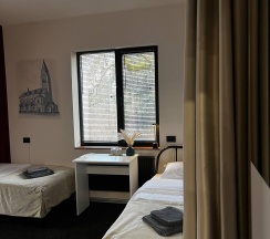 Кровать в 3-местном общем женском номере в Прусс