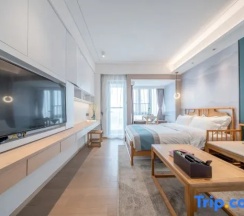 Двухместный номер Executive с балконом двуспальная кровать в Yidiandian Hotel Apartment (Shenzhen International Convention And Exhibition Center)