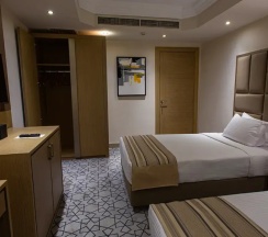 Двухместный семейный люкс Executive (2 отдельные кровати) в Triumph Plaza Hotel