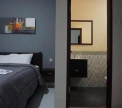 Двухместный номер Standard с балконом и с видом на сад двуспальная кровать в Mai Guesthouse Sanur