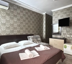 Двухместный номер Standard Мансарда с балконом и с красивым видом из окна двуспальная кровать в Тропики